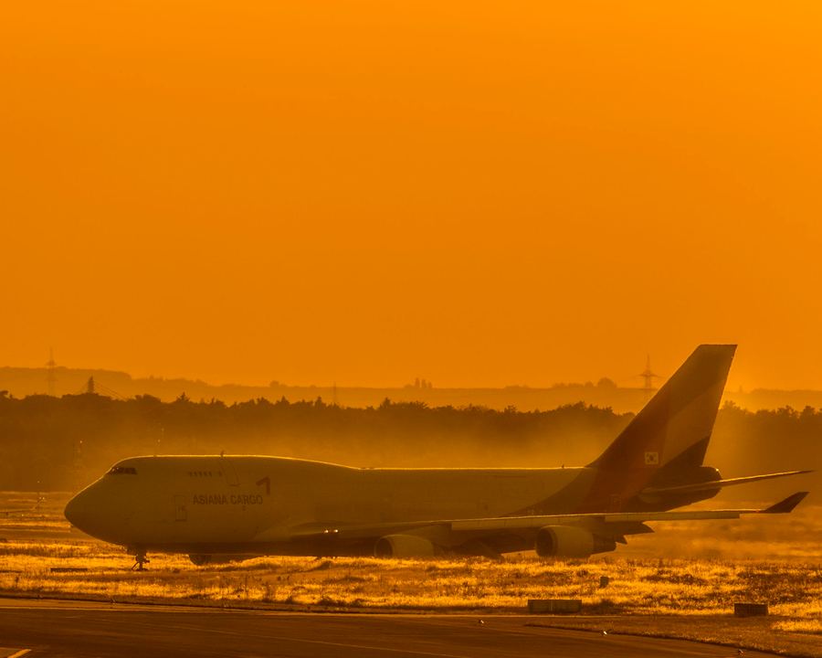 Boeing 747 freighter taxiing at sunset